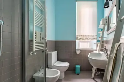 a bathroom with a toilet and a sink at Walking to Trastevere di Marialaura Aragno in Rome