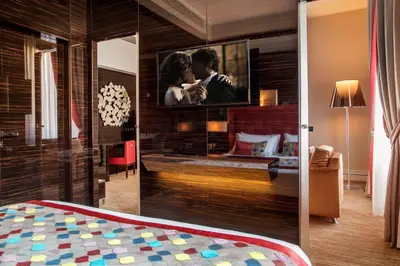 a bedroom with a picture of a couple on the wall at Gioberti Art Hotel in Rome