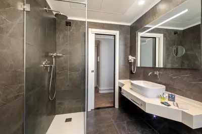 a bathroom with a sink and a shower at Gioberti Art Hotel in Rome