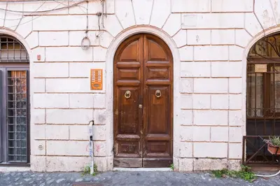 a wooden door on the side of a building at Trastevere Suite Just Renewed in Rome