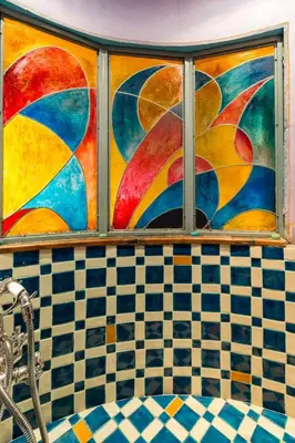 a window in a bathroom with a checkered wall at Apartment 'Colo' by Interhome in Rome