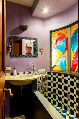 a bathroom with a sink and a mirror at Apartment 'Colo' by Interhome in Rome