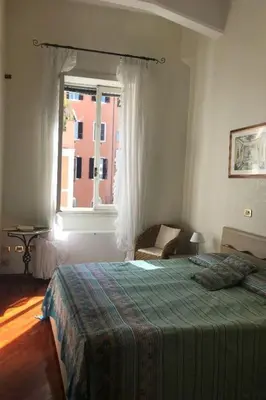 a bedroom with a bed and a window at Apartment Appartement mit Dachterrasse by Interhome in Rome