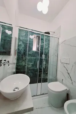 a bathroom with a sink and a shower and a toilet at Apartment 'Rhome Sweet Rhome by Interhome in Rome