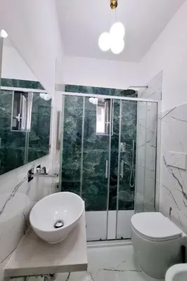 a bathroom with a sink and a toilet and a shower at Apartment 'Rhome Sweet Rhome by Interhome in Rome