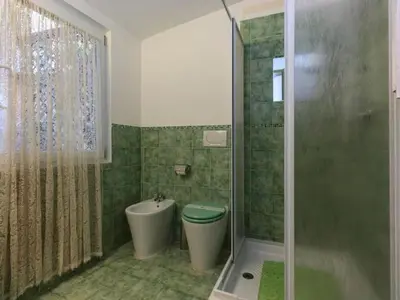 a bathroom with a toilet and a shower at Apartment Charmantes- komfortables Studio im Herzen von Rom by Interhome in Rome