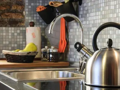 a kitchen sink with a tea kettle on a counter at Apartment Charmantes- komfortables Studio im Herzen von Rom by Interhome in Rome