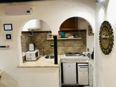 a small kitchen with a sink and a counter at House&Colosseum in Rome