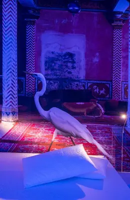 a white swan standing on a table in a room at Trevi Elite Rome in Rome