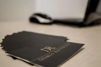 a black card sitting on a desk with a mouse at Domus Raffaello in Rome