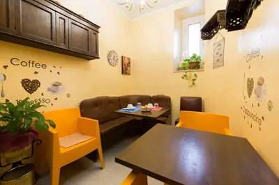 a coffee room with a table and a couch at Ai 7 Scalini in Rome