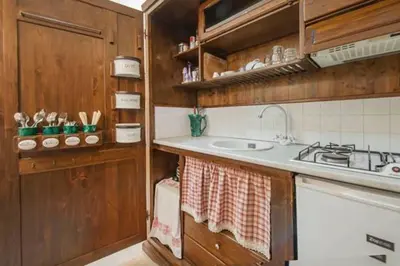 a small kitchen with a sink and a stove at Ai 7 Scalini in Rome