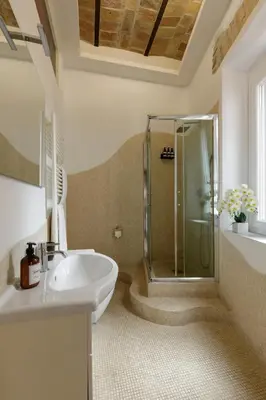 a bathroom with a sink and a shower at The Right Place 4U Navona Luxury Rooms in Rome