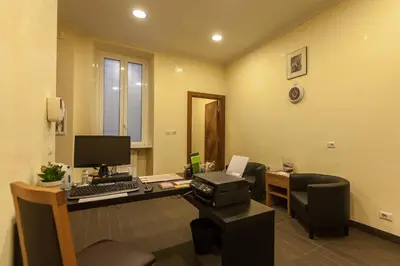 an office with a desk with a computer on it at Guest's Heaven in Rome