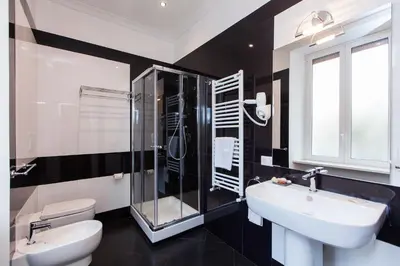 a bathroom with a shower and a sink and a toilet at Guest's Heaven in Rome