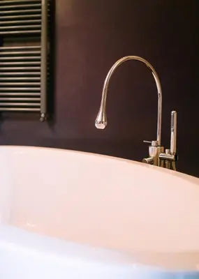 a sink with a faucet in a bathroom at Terrazza Munira Trastevere in Rome