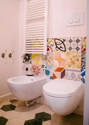 a bathroom with a toilet and a sink at Terrazza Munira Trastevere in Rome