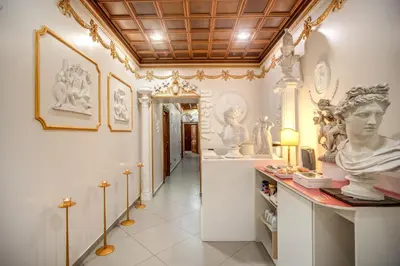 a room with statues on display in a museum at Artemis in Rome