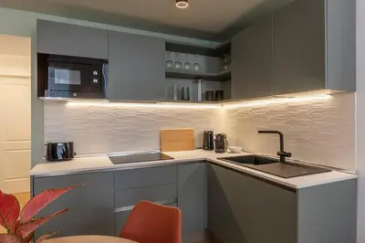 a kitchen with a sink and a counter top at Appartamento moderno e silenzioso a Trastevere in Rome