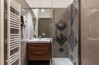 a bathroom with a sink and a shower at Loft tra Castel Sant'Angelo e centro storico in Rome