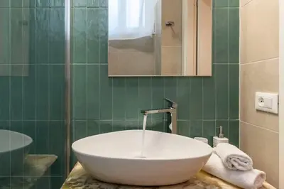 a bathroom with a large white sink on a counter at Loft moderno e silenzioso a Trastevere in Rome