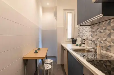a small kitchen with a sink and a counter at Vivace appartamento con splendido giardino in Rome