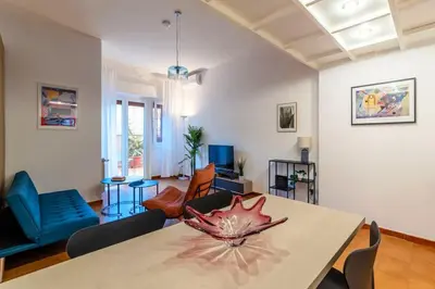 a living room with a table with a maple leaf on it at Vivace appartamento con splendido giardino in Rome