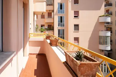 a balcony of a building with potted plants on it at Appartamento panoramico vicino San Pietro e Vaticano in Rome
