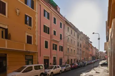 a row of buildings on a street with parked cars at Appartamento nel cuore del pittoresco Pigneto in Rome