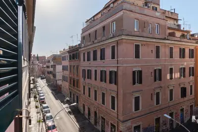 a large brick building on a city street at Appartamento nel cuore del pittoresco Pigneto in Rome