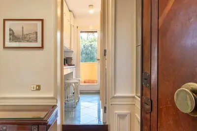 a hallway with a door leading to a room at Delizioso loft con terrazzo panoramico a Flaminio in Rome