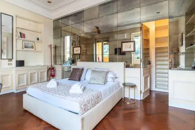 a bedroom with a large white bed in a room at Delizioso loft con terrazzo panoramico a Flaminio in Rome
