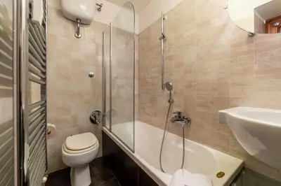 a bathroom with a shower and a toilet and a sink at Loft a due passi dal Pantheon in Rome