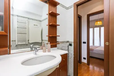 a bathroom with a sink and a mirror at Quieto alloggio vicino stazione e metropolitana in Rome