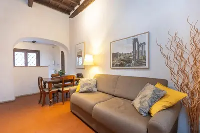 a living room with a couch and a table at Autentico appartamento vicino al Pantheon in Rome