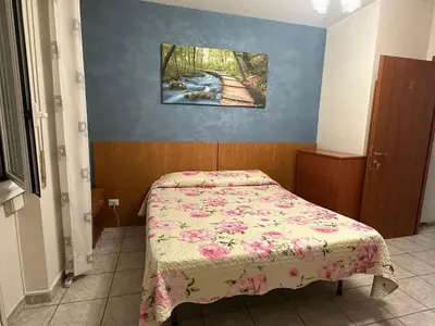 a small bedroom with a bed in a room at Sofia Holiday Home in Rome