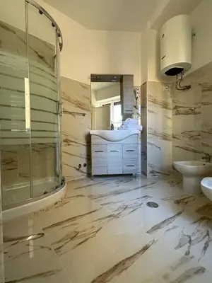 a bathroom with a sink and a shower at Sofia Holiday Home in Rome