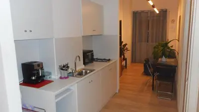 a kitchen with a sink and a counter top at Lo Studio Guest House in Rome