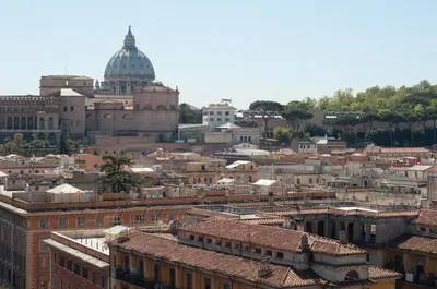 a view of a city with a cathedral and buildings at Terrazza San Pietro in Rome