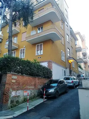 two cars parked in front of a building at Il Cavaliere in Rome