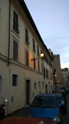 a blue car parked in front of a building at NEW GENERATION HOSTEL Rome center in Rome