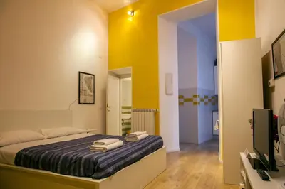 a bedroom with a bed with towels on it at Trasteverome45 in Rome