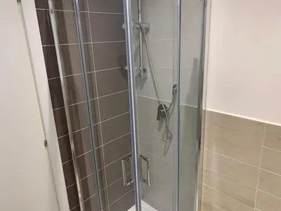 a shower with a glass door in a bathroom at Trasteverome45 in Rome