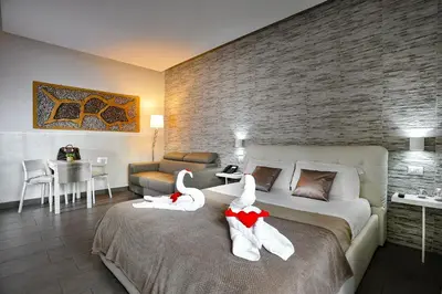 a bedroom with a large bed with two swans on it at Domus Castroni Pompeo Magno in Rome