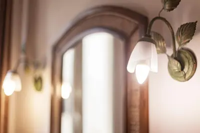 a group of lights hanging from a wall at TrastEver Holiday in Rome