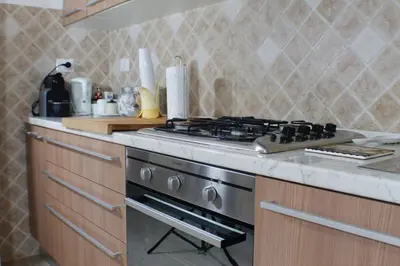 a kitchen with a stove and a counter top at Vatican In The Moonlight Apartment in Rome