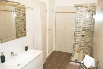 a bathroom with a sink and a shower at Vatican In The Moonlight Apartment in Rome