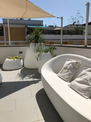 a white bath tub sitting on top of a roof at Glamroom Luxury Terrace in Rome
