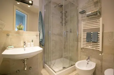 a bathroom with a sink and a shower at Cola Di Rienzo A E B in Rome