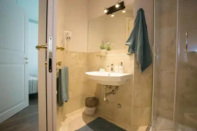 a bathroom with a sink and a shower at Cola Di Rienzo A E B in Rome